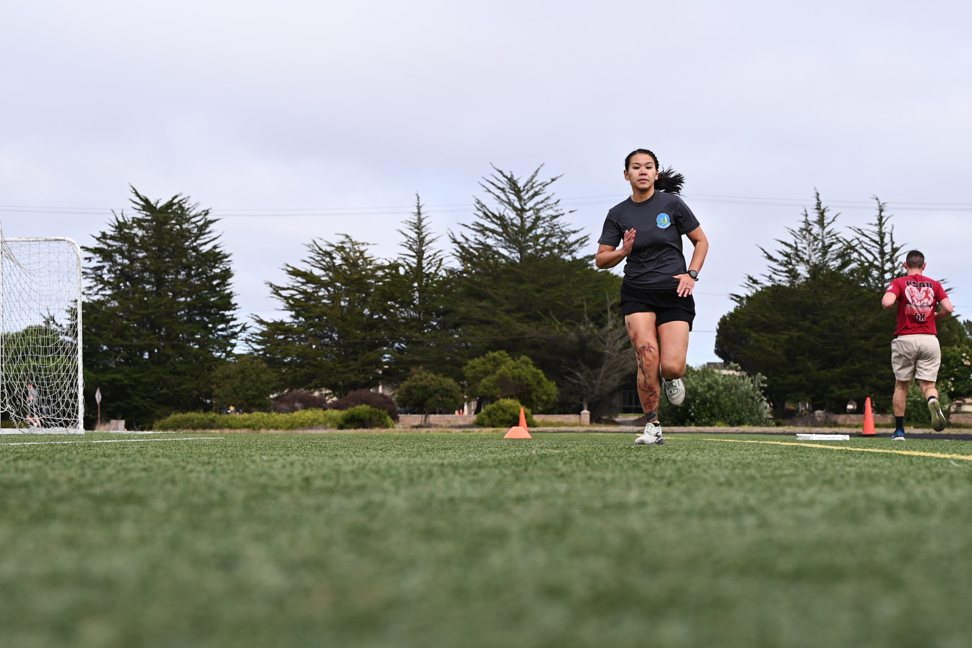 a person sprinting on lawn