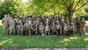 Airmen pose for a photo.