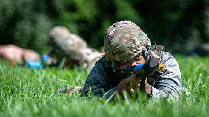 Airman guarding wingmen.