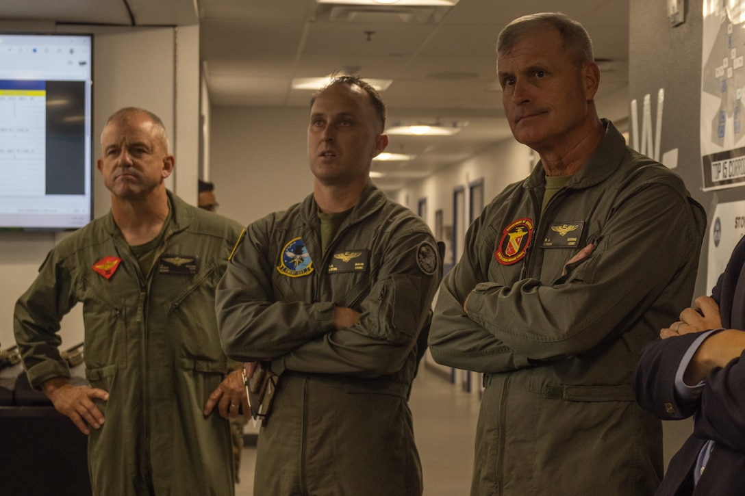 From right to left, U.S. Marine Corps Lt. Gen. Bradford J. Gering, the deputy commandant for aviation, Lt. Col. Stephen T. Davis, the commanding officer of Marine Fighter Attack Training Squadron (VMFAT) 502, Marine Aircraft Group 11, 3rd Marine Aircraft Wing, and Maj. Gen. James B. Wellons, the commanding general of 3rd MAW, participate in a logistics brief at Marine Corps Air Station Miramar, California, July 29, 2025. Gering visited 3rd MAW to share operational insights with key leaders to reinforce readiness and effectiveness in the six functions of Marine Corps aviation. (U.S. Marine Corps photo by Cpl. Renee Gray)