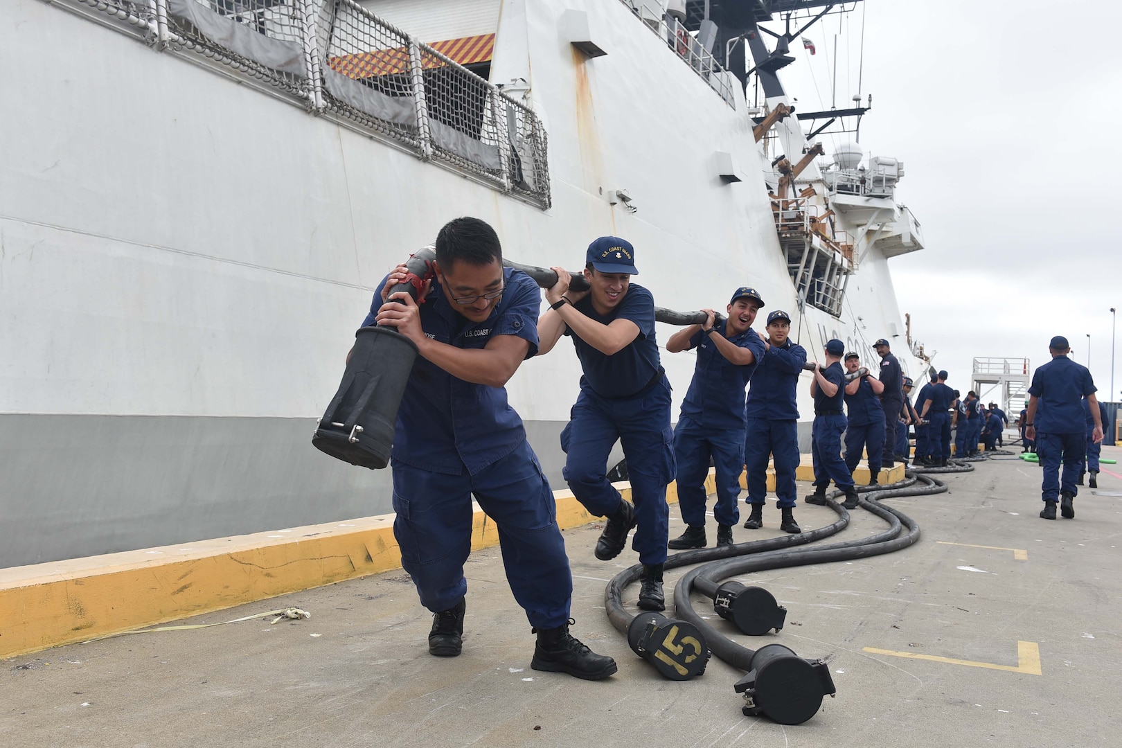 Crew members of the U.S. Coast Guard Cutter Stratton (WMSL 752) handle the cutter's electrical shore tie connection after returning to their Base Alameda, California, home port following a 134-day Western Pacific patrol, July 30, 2025. Stratton’s deployment contributed to regional cooperation and enhanced global maritime governance through integrated deterrence and strengthened partnerships.  U.S. Coast Guard photo by Petty Officer 3rd Class Danish Khan.