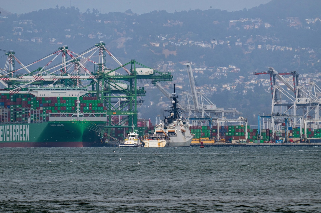 U.S. Coast Guard Cutter Stratton (WMSL 752) steams past the Port of Oakland on its way towards Coast Guard Island during the ship's return to home port, July 30, 2025. Stratton’s deployment contributed to regional cooperation and enhanced global maritime governance through integrated deterrence and strengthened partnerships. (U.S. Coast Guard photo by Petty Officer 3rd Class Austin Wiley)
