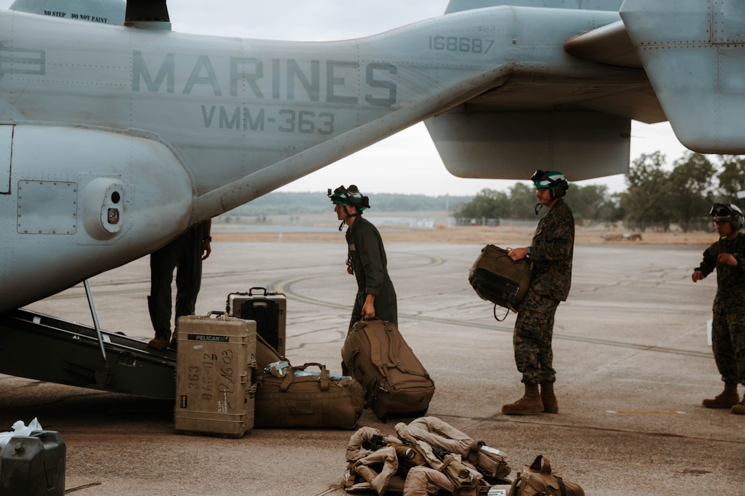 U.S. Marines with Marine Medium Tiltrotor Squadron (VMM) 363, Marine Rotational Force – Darwin 25.3, begin loading bags onto an MV-22B Osprey before departing to the Philippines, at Royal Australian Air Force Base Darwin, Australia, July 26, 2025.