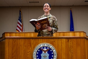 Tech. Sgt. Lacey Eakin, 8th Fighter Wing Staff Judge Advocate Office noncommissioned officer in charge of military justice, poses for a photo in the courtroom