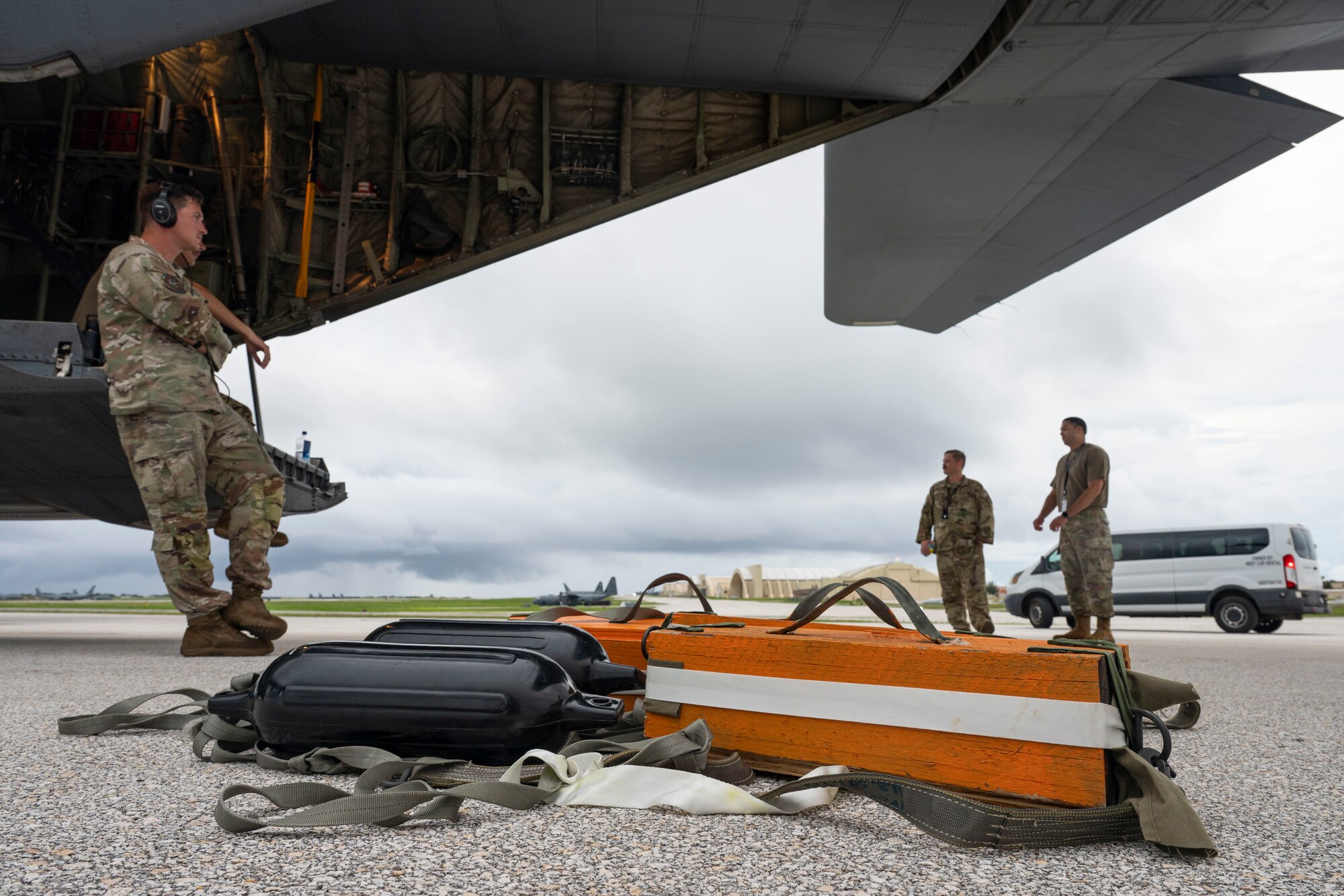 Equipment sits on the flight line as a crew prepares to conduct a mission.
