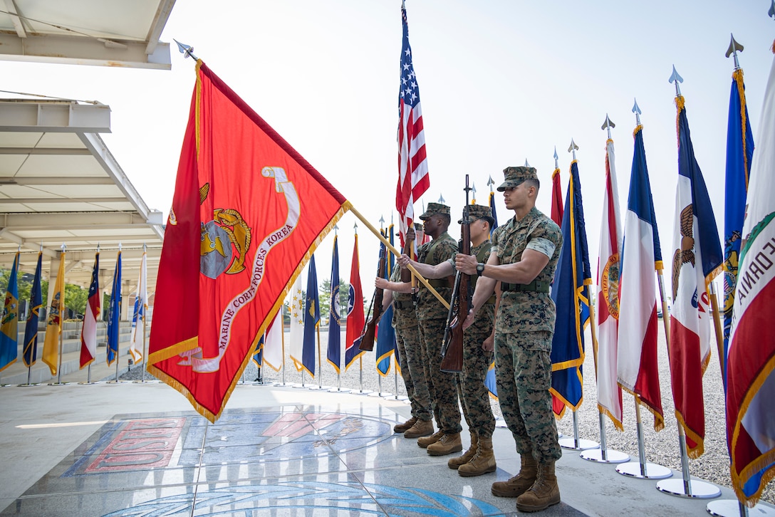 U.S. Marines with U.S. Marine Corps Forces Korea present the colors during the MARFORK 30th anniversary and colors and rededication ceremony at U.S. Army Garrison Humphreys, South Korea, May 29, 2025. MARFORK was activated on June 1, 1995, at Seoul, Republic of Korea to support U.S. Marine Corps operations, strengthen interoperability with the Republic of Korea Marine Corps and serve as the U.S. Marine Corps service component for United States Forces Korea and United Nations Command. (U.S. Marine Corps photo by Cpl. Nikolas Mascroft)
