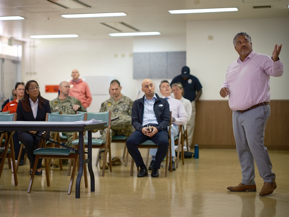 Esteban Abreu, Commander, Fleet Activities Yokosuka (CFAY) Navy Housing director, discusses the installation pet policy at the morning session of the CFAY Town Hall Wednesday, May 28