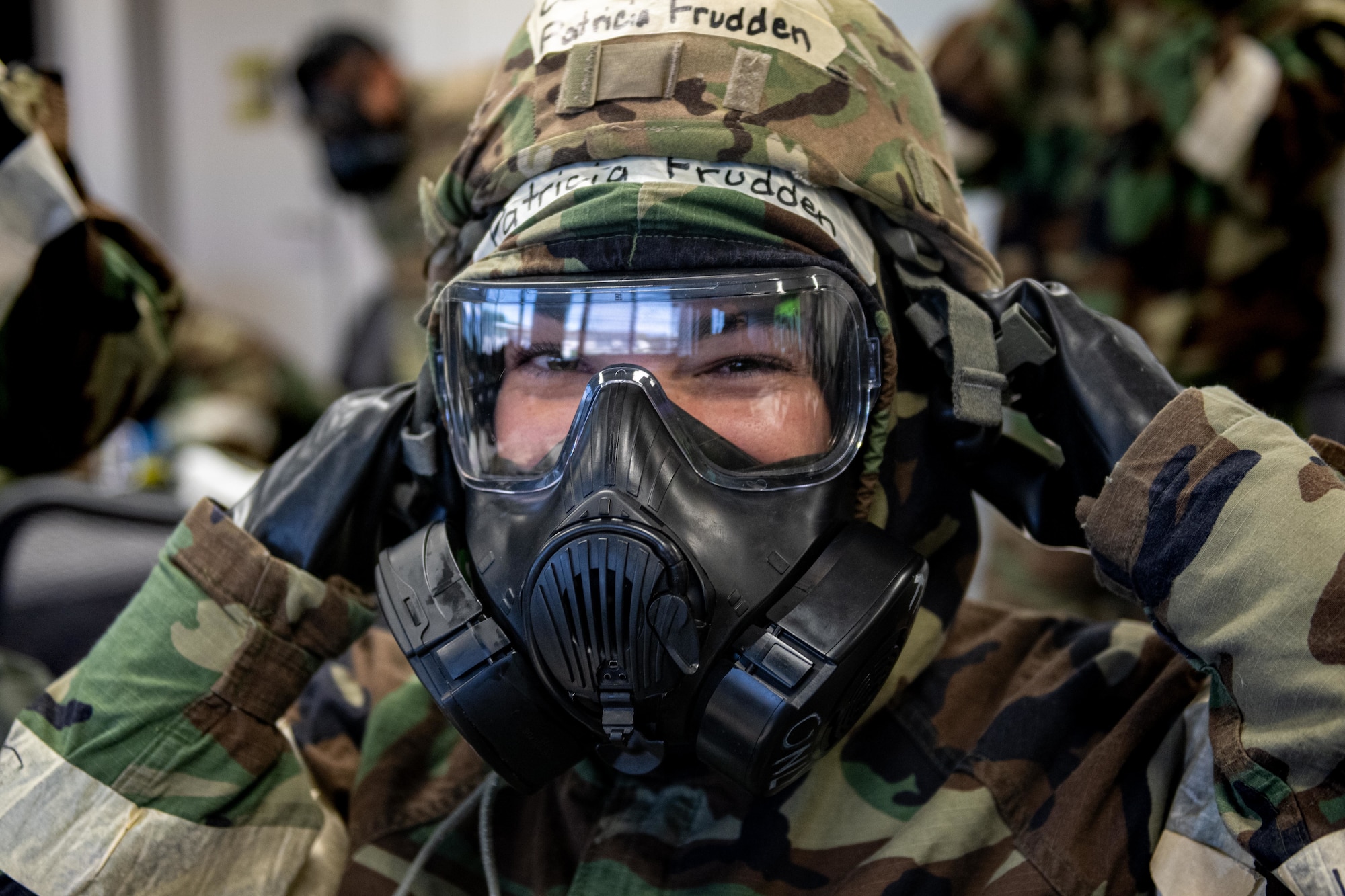 Airman dons MOPP gear.
