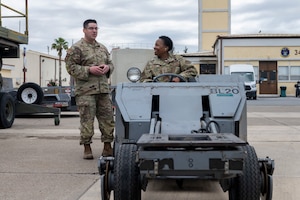 U.S. Air Force Tech Sgt. Joseph Hopkins, 39th Maintenance Squadron aerospace ground equipment flight chief, explains the importance of a MJ-1 Jammer vehicle to Chief Master Sgt. Kim Elliott, 39th Medical Group senior enlisted leader, at Incirlik Air Base, Türkiye, May 30, 2025.