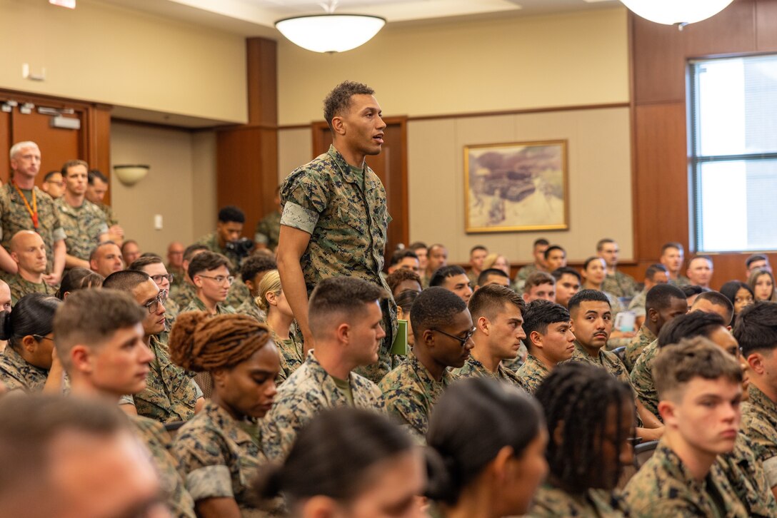 A U.S. Marine asks a question to retired U.S. Marine Corps Maj. Gen. James Livingston, Medal of Honor recipient and first commander of Marine Forces Reserve during his visit to Marine Corps Support Facility, New Orleans, May 30, 2025. Livingston served as the first commander of Marine Forces Reserve from July 1992 to October 1994. (U.S. Marine Corps photo by Lance Cpl. Juan Diaz)