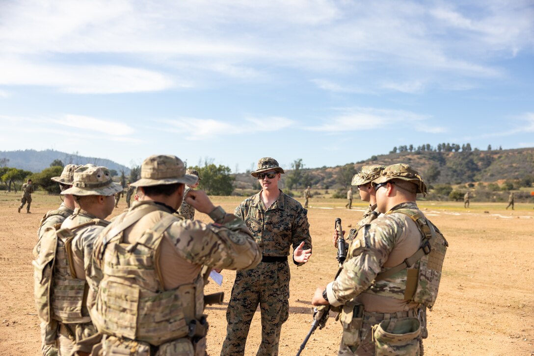 U.S. Marines with 1st Battalion, 25th Marines, 4th Marine Division and Chilean Marines receive a safety brief before they participate in a live fire exercise during exercise Southern Star 25 at Fuerte Aguayo, Chile, May 29, 2025. Southern Star is a multinational training exercise emphasizing operational and tactical missions, bringing together joint, combined, interagency, and military forces to strengthen coordination and interoperability within a unified special operations command. (U.S. Marine Corps photo by Lance Cpl. Payton Goodrich)