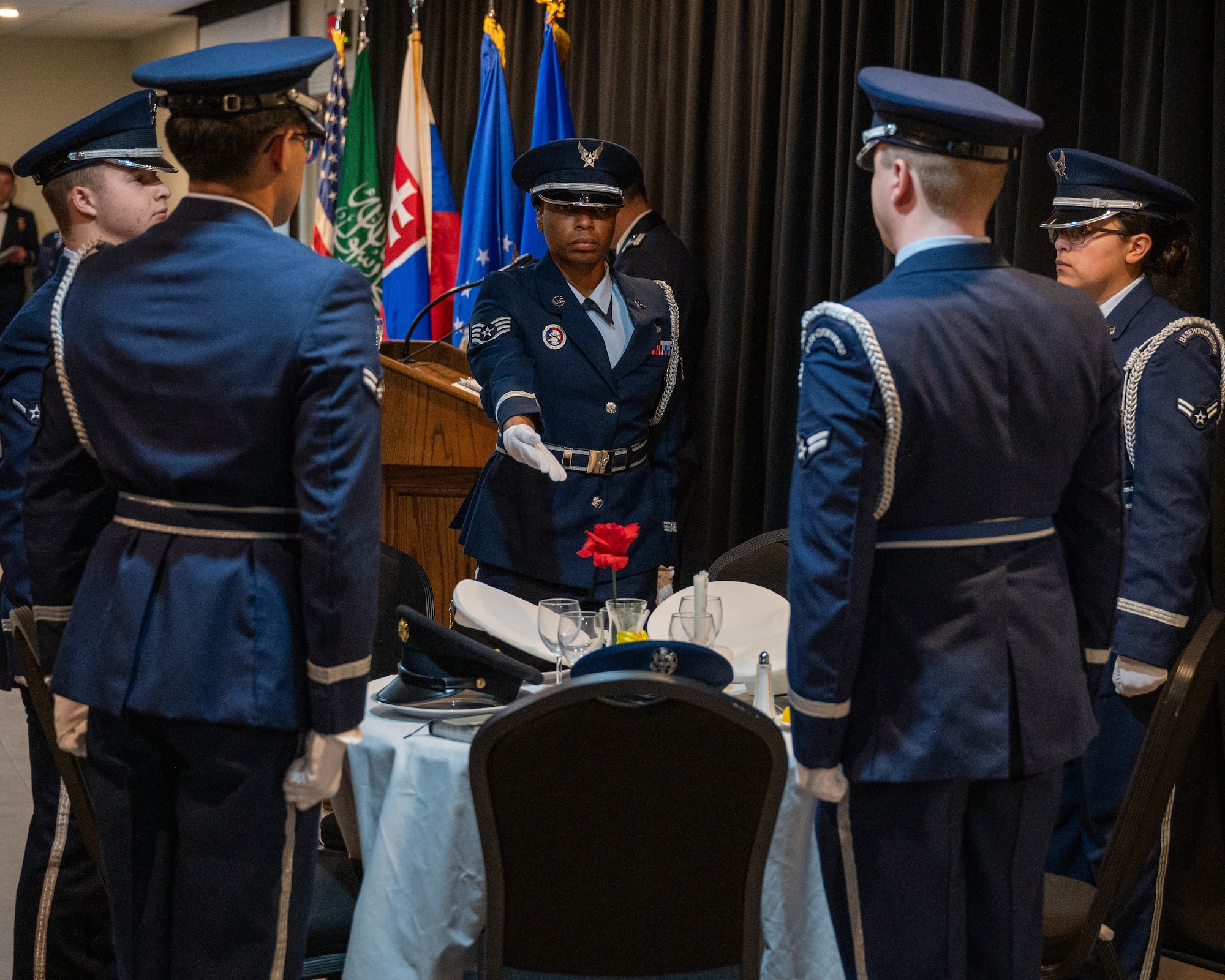 The Laughlin Air Force Base Honor Guard set the Missing Man Missing in Action/Prisoner of War table at the Class 25-10 graduation at Laughlin Air Force Base, Texas, May 29, 2025. The MIA/POW table honors the sacrifices made by those who answered the call. (U.S. Air Force photo by Staff Sgt. Nicholas Larsen)