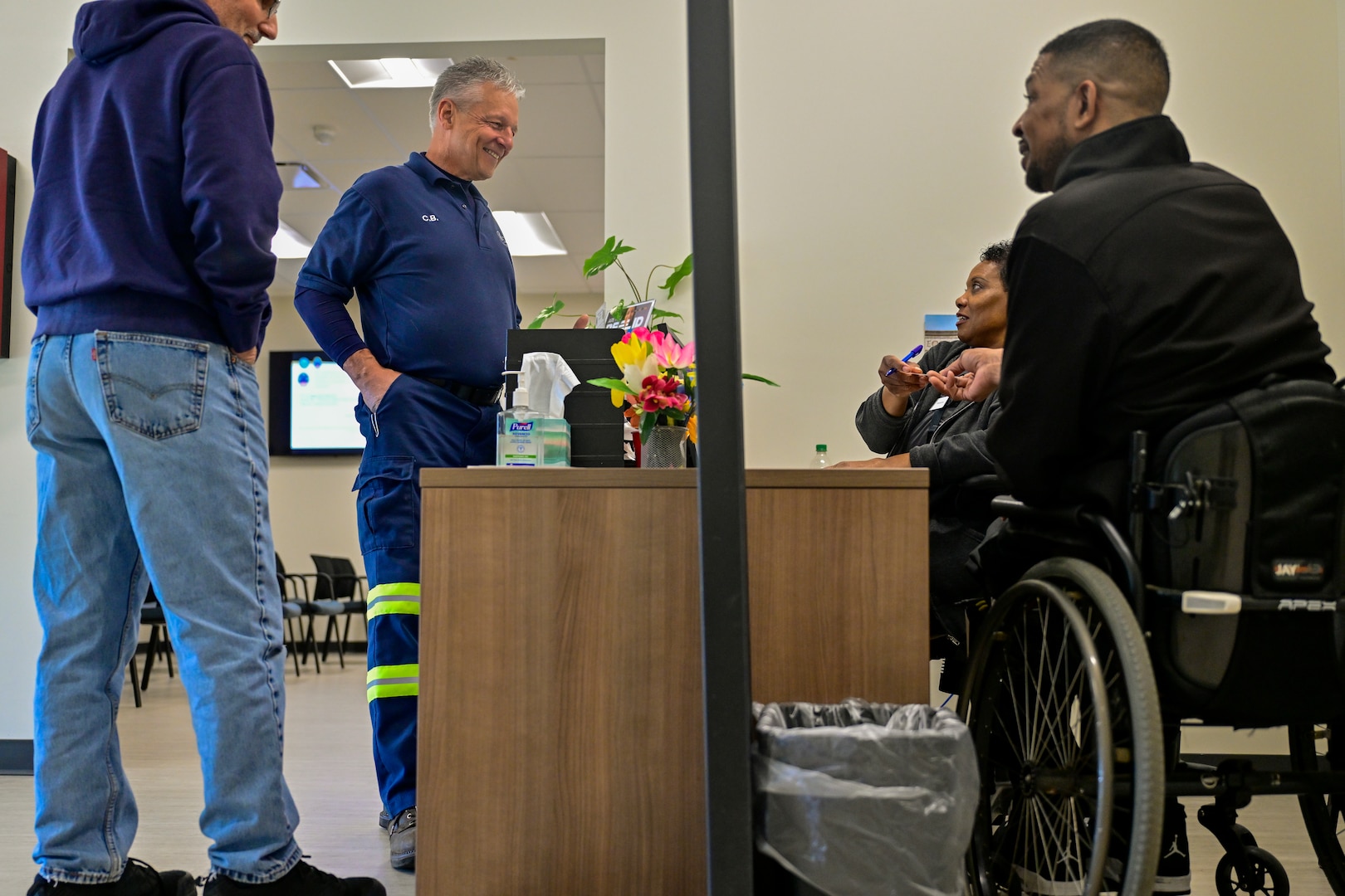 Visitor Center employees assist customers.