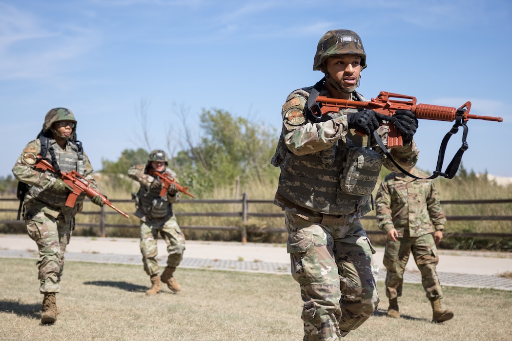 Image of a group of Airmen with weapons training.