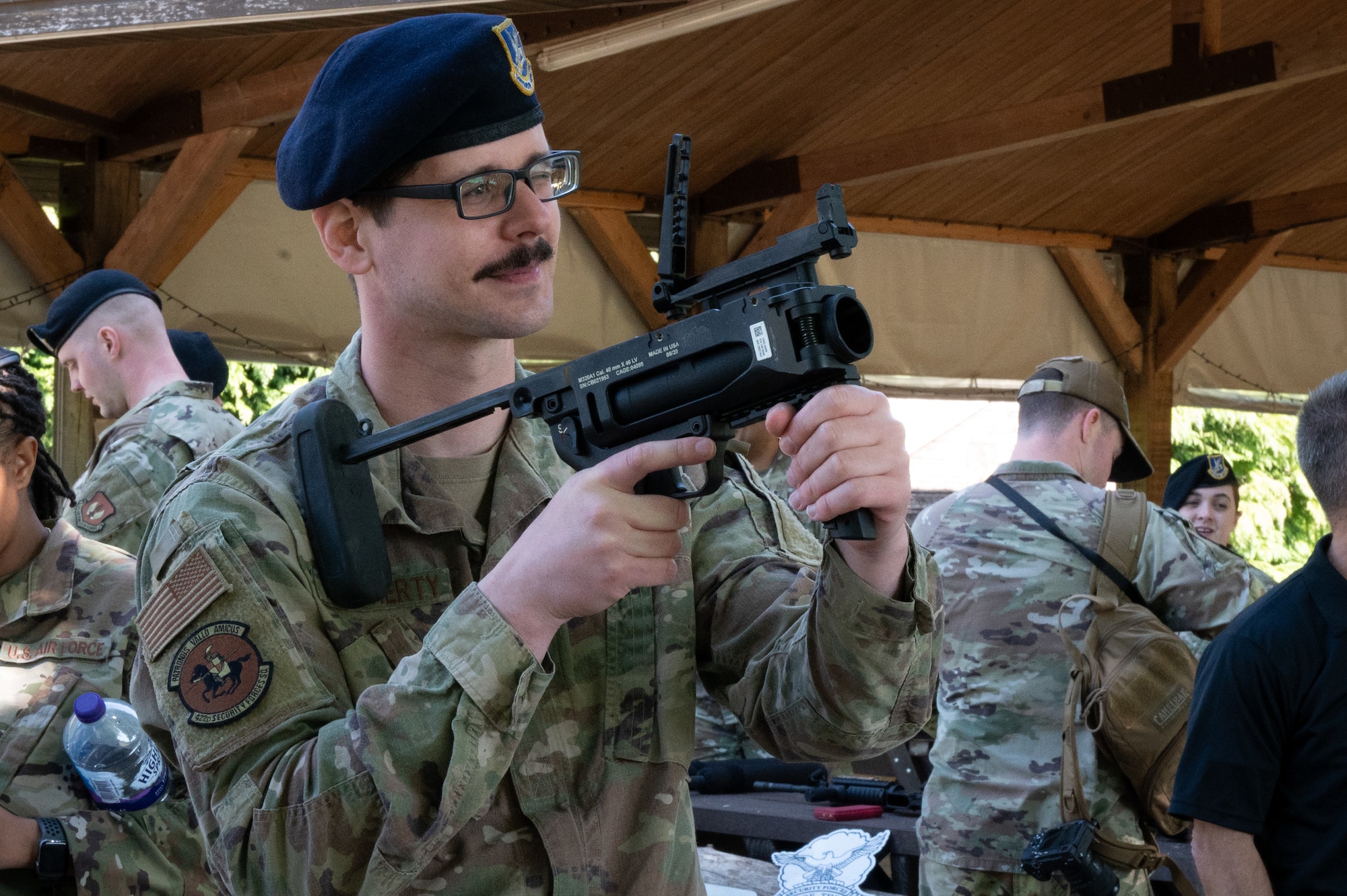 U.S. Air Force Staff Sgt. Kenneth Daugherty, 422nd Air Base Squadron unit deployment manager, aims an A320 Grenade Launcher