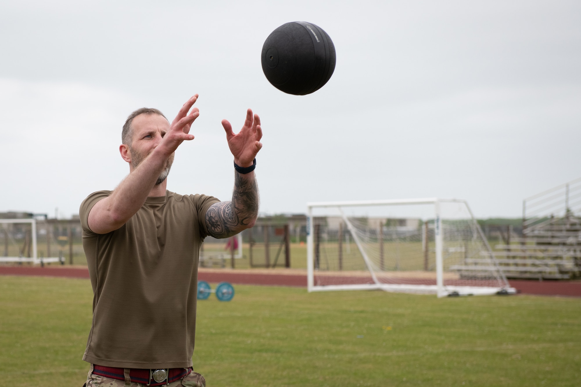 British Army Warrant Officer Class 2 (WO2) Adam Galen-Bisping catches a ball
