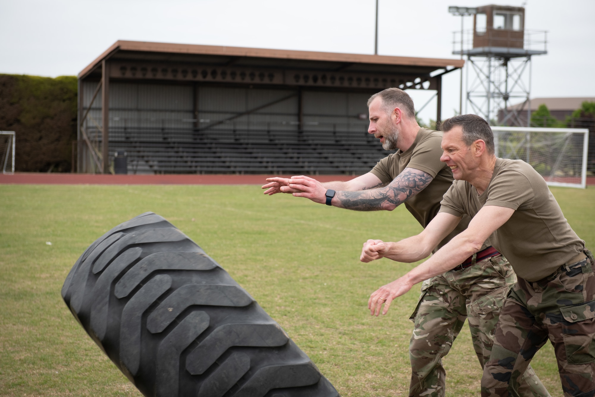 Pathfinders push a tire