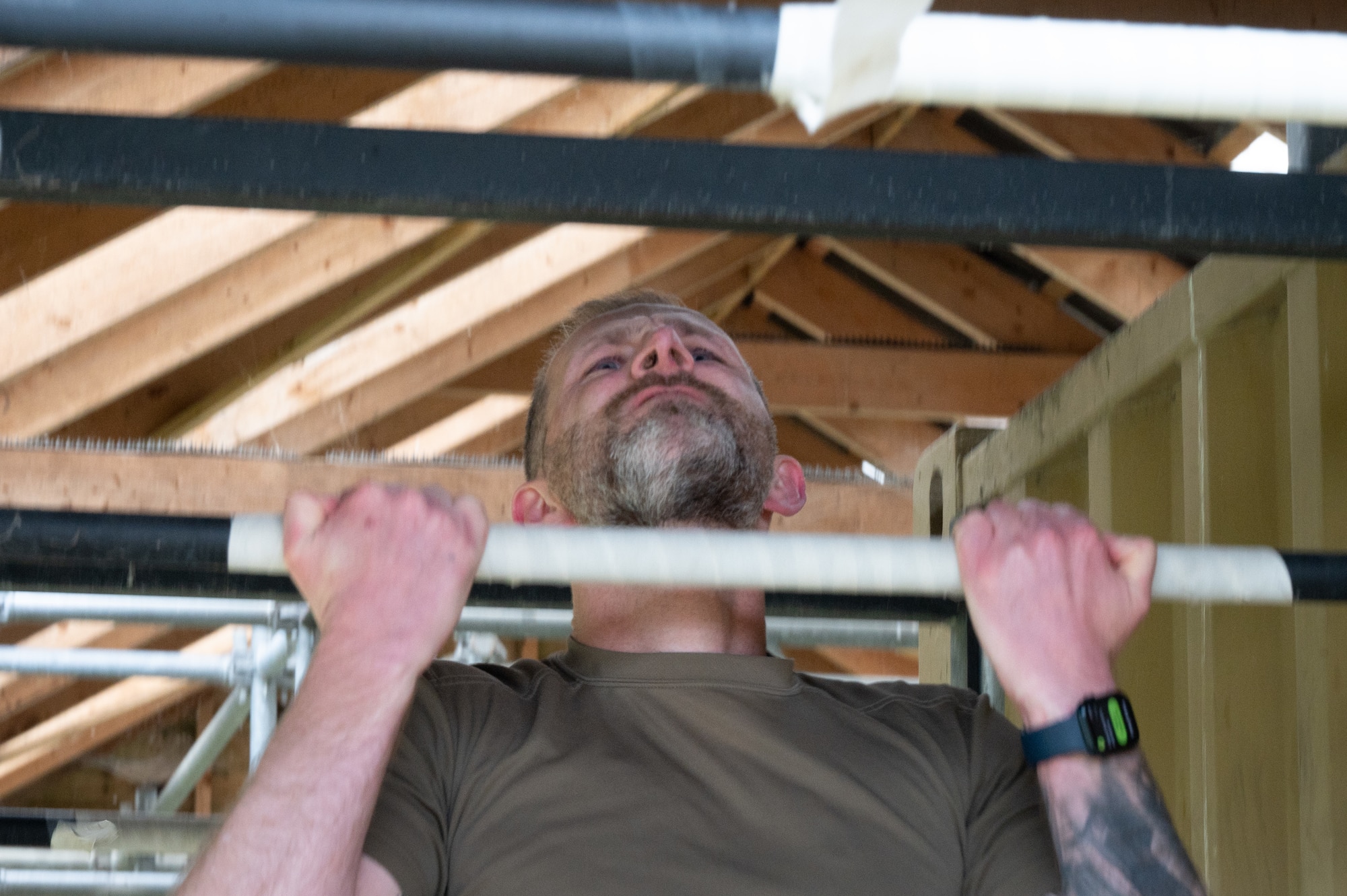 British Army Warrant Officer Class 2 (WO2) Adam Galen-Bisping performs pull-ups