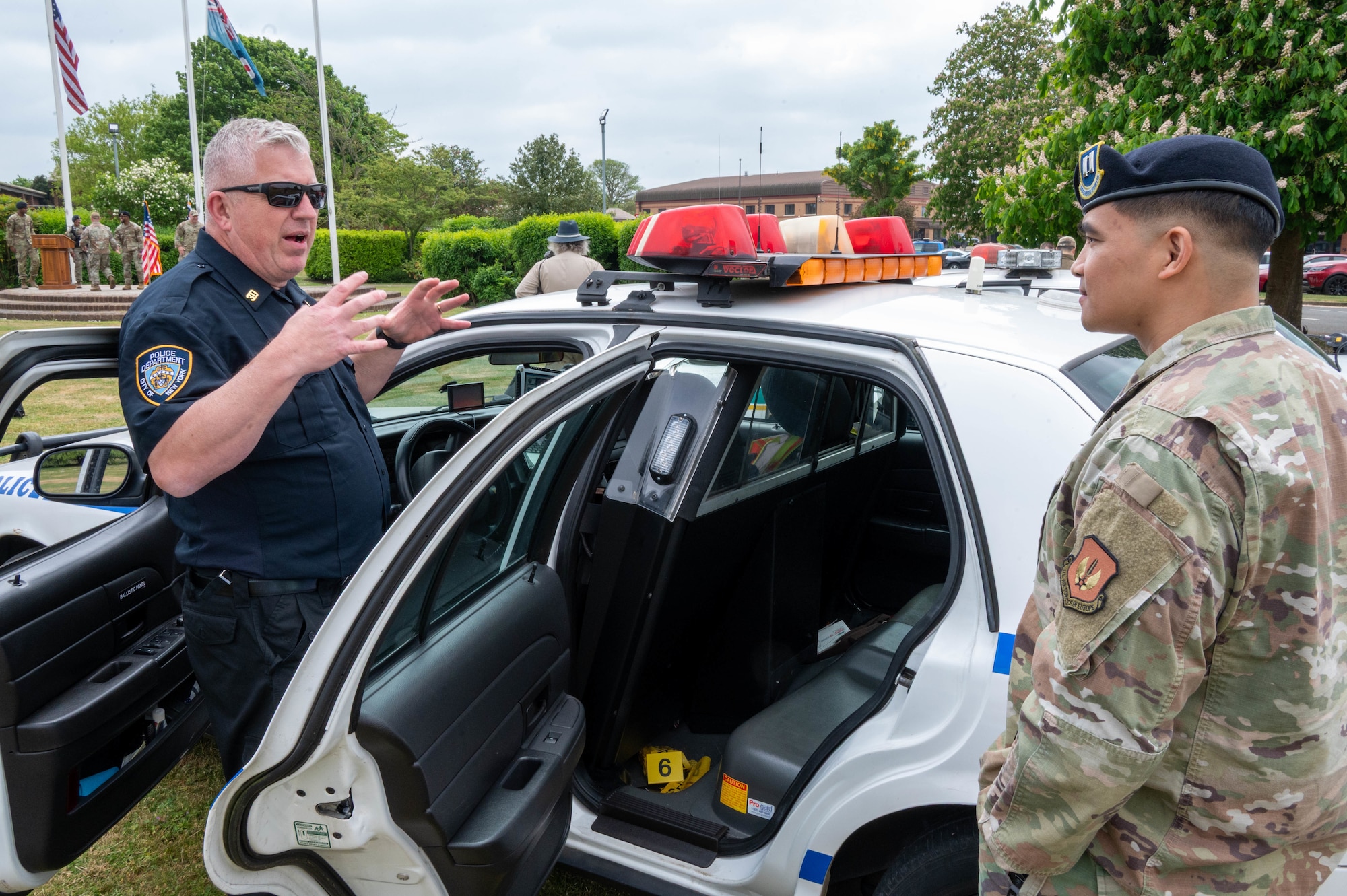 A defender speaks with a police enthusiast