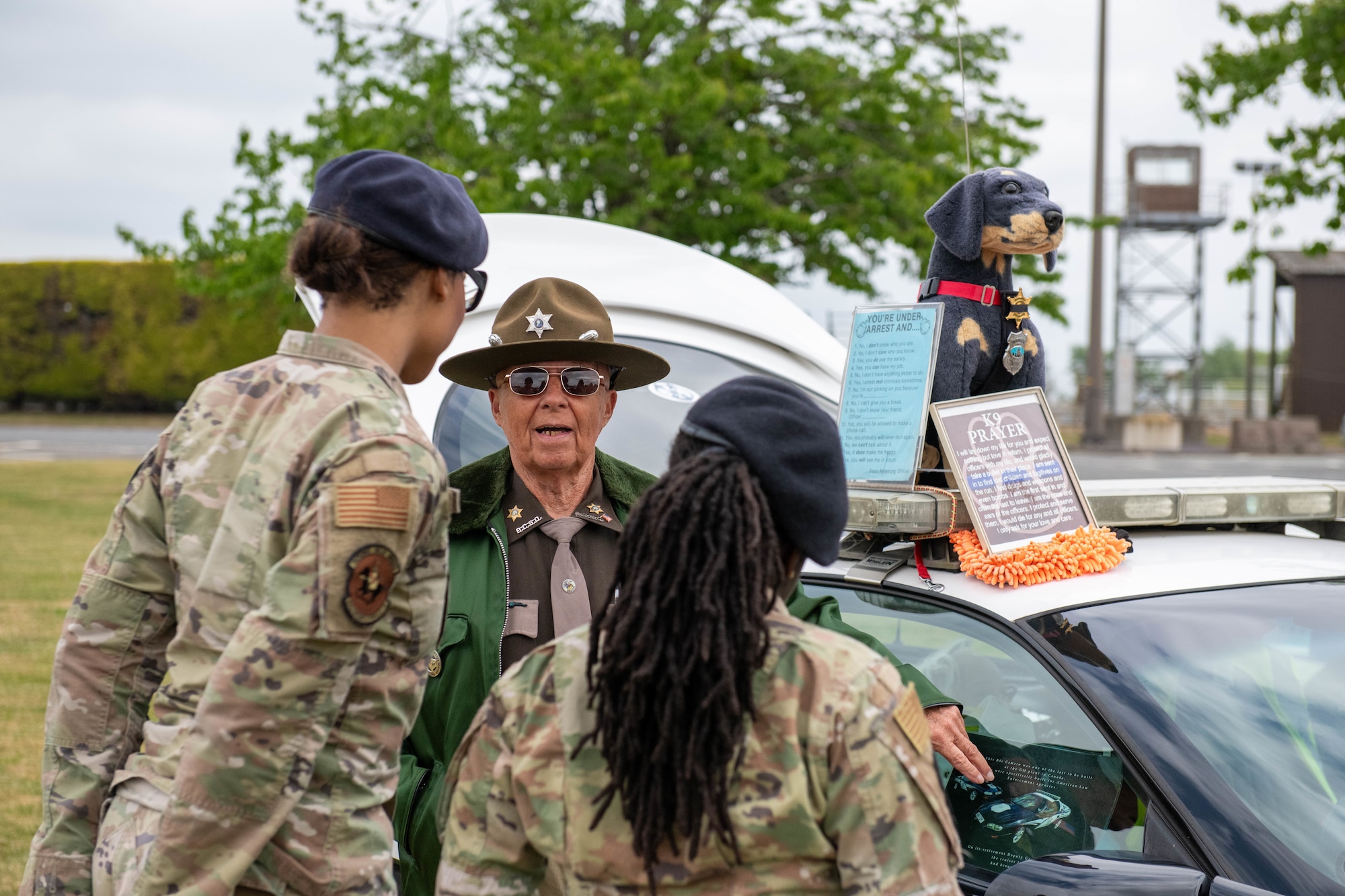 wo defenders speak with a local police