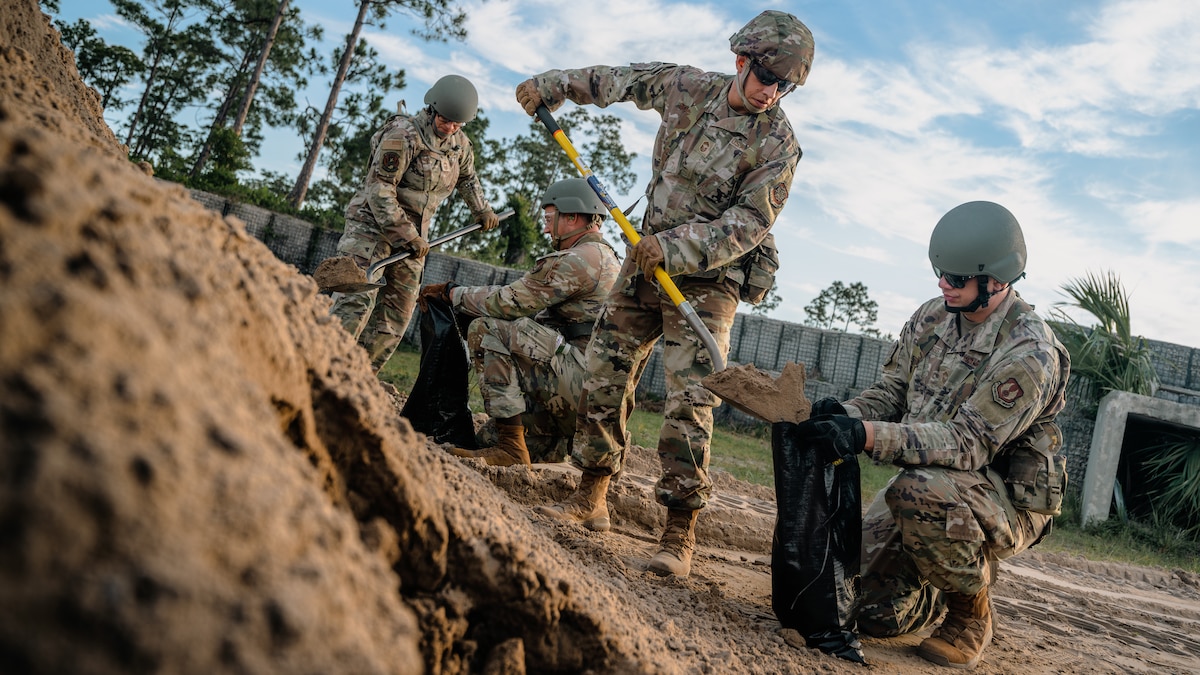 U.S. Airmen filling sandbags