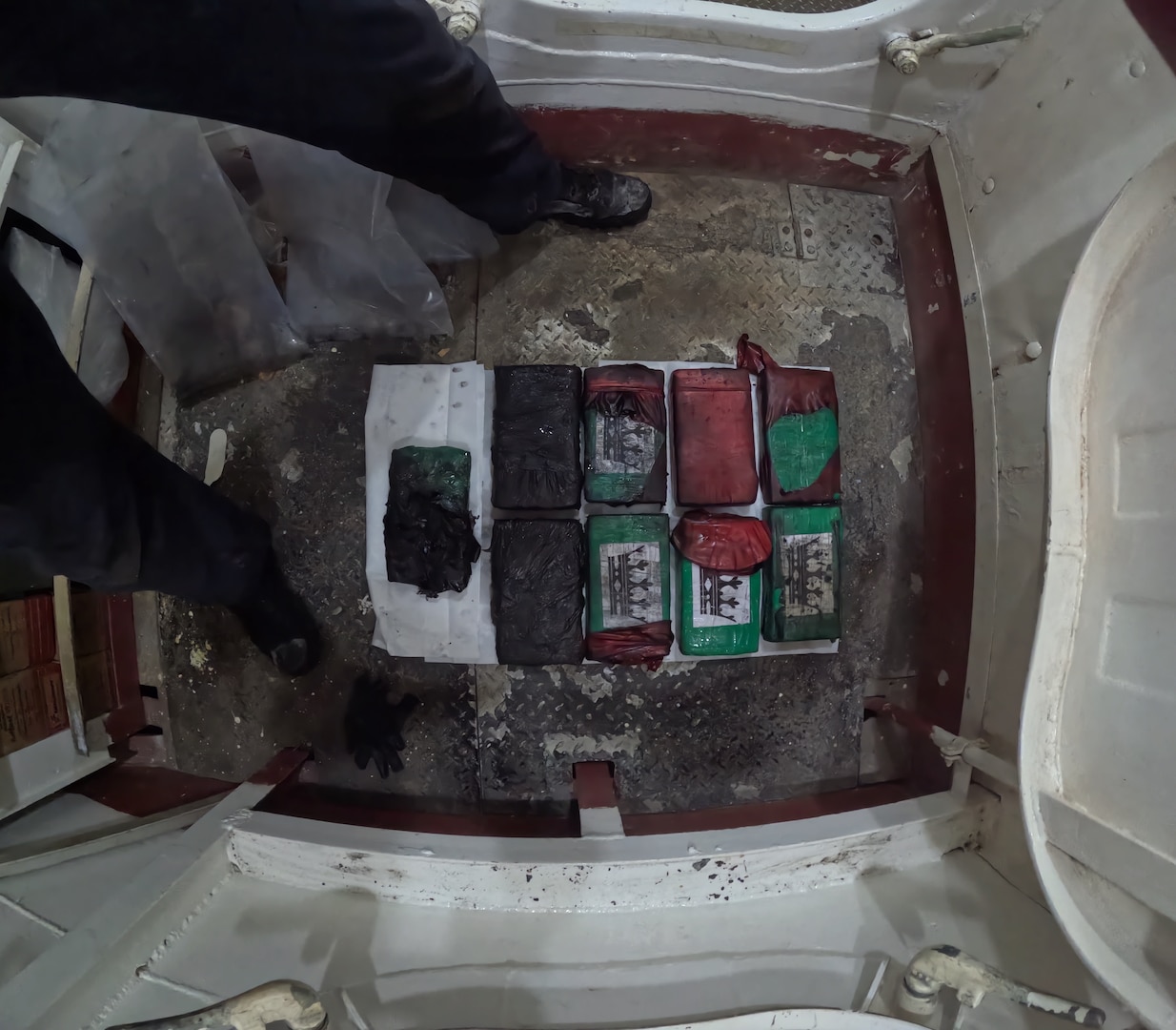 Coast Guard Cutter Diligence (WMEC 616) crew members seize approximately 40 pounds of cocaine from a disabled sailing vessel in the Caribbean Sea, April 24, 2025. Diligence's crew conducted a 61-day counter-drug and fisheries patrol in the Caribbean Sea and Gulf of America. (U.S. Coast Guard photo)