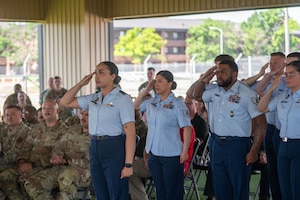 Members of the 17th Security Forces Squadron salute Maj. Jonathan Estep, incoming 17th Security Forces Squadron commander, during the change of command ceremony at the  Military Working Dogs kennels’ overhang, Goodfellow Air Force Base, Texas, June 2, 2025. The salute represents the squadron welcoming its new commander. (U.S. Air Force photo by Airman 1st Class James Salellas)