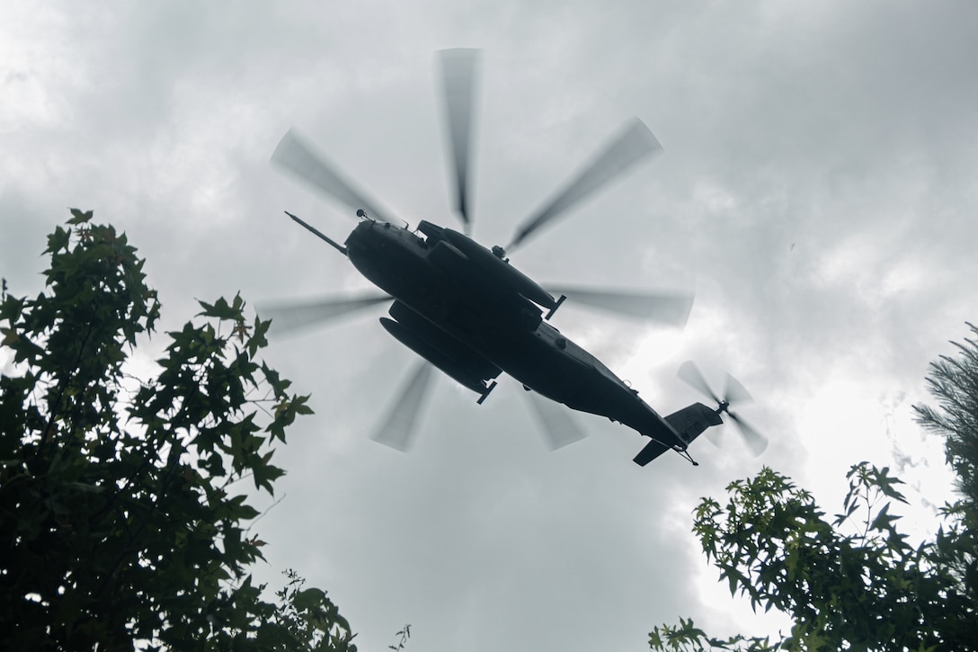 A U.S. Marine Corps CH-53E Super Stallion with Marine Medium Tiltrotor Squadron 263 (Reinforced), 22nd Marine Expeditionary Unit, prepares to land during a simulated non-combatant evacuation operation, as part of Iwo Jima Amphibious Ready Group Marine Expeditionary Unit exercise, at Marine Corps Base Stone Bay, North Carolina, May 28, 2025. During ARGMEUEX, the 22nd MEU, aboard IWOARG shipping, conducts various mission essential tasks that enhance operational readiness and lethality as a unified IWOARG/22 MEU team. (U.S. Marine Corps photo by Cpl. Maurion Moore)