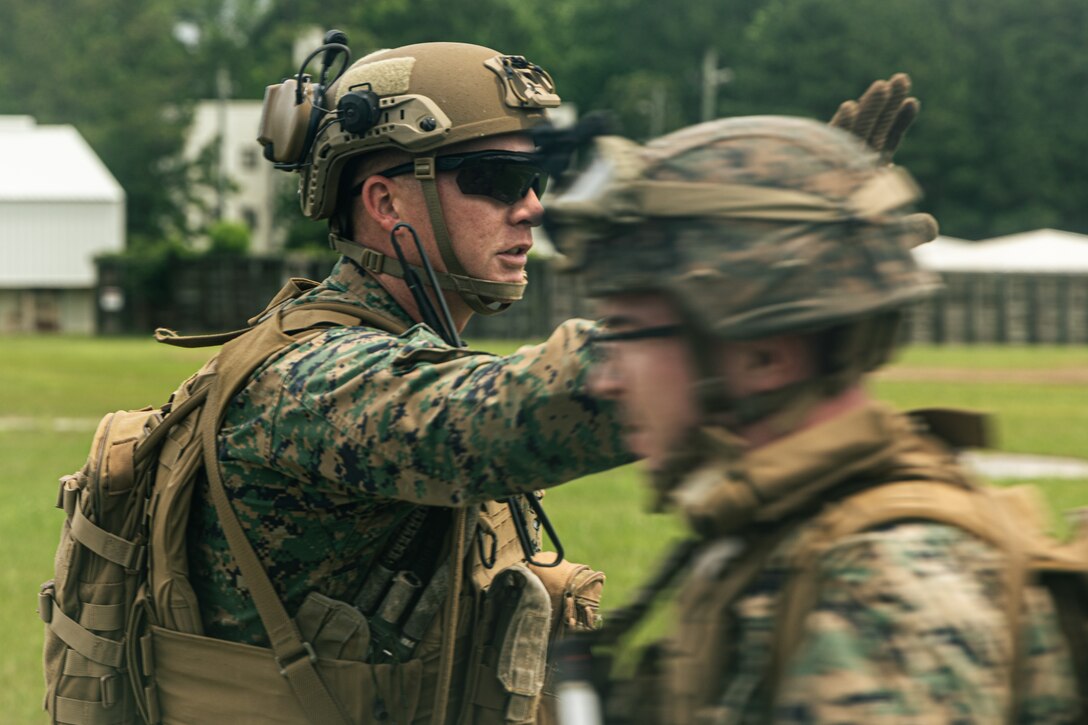 U.S. Marine Corps 1st Sgt. Dalton Miller, company first sergeant with Lima Company, Battalion Landing Team 3/6, 22nd Marine Expeditionary Unit, counts personnel during a simulated non-combatant evacuation operation, as part of Iwo Jima Amphibious Ready Group Marine Expeditionary Unit exercise, at Marine Corps Base Stone Bay, North Carolina, May 28, 2025. During ARGMEUEX, the 22nd MEU, aboard IWOARG shipping, conducts various mission essential tasks that enhance operational readiness and lethality as a unified IWOARG/22 MEU team. (U.S. Marine Corps photo by Cpl. Maurion Moore)
