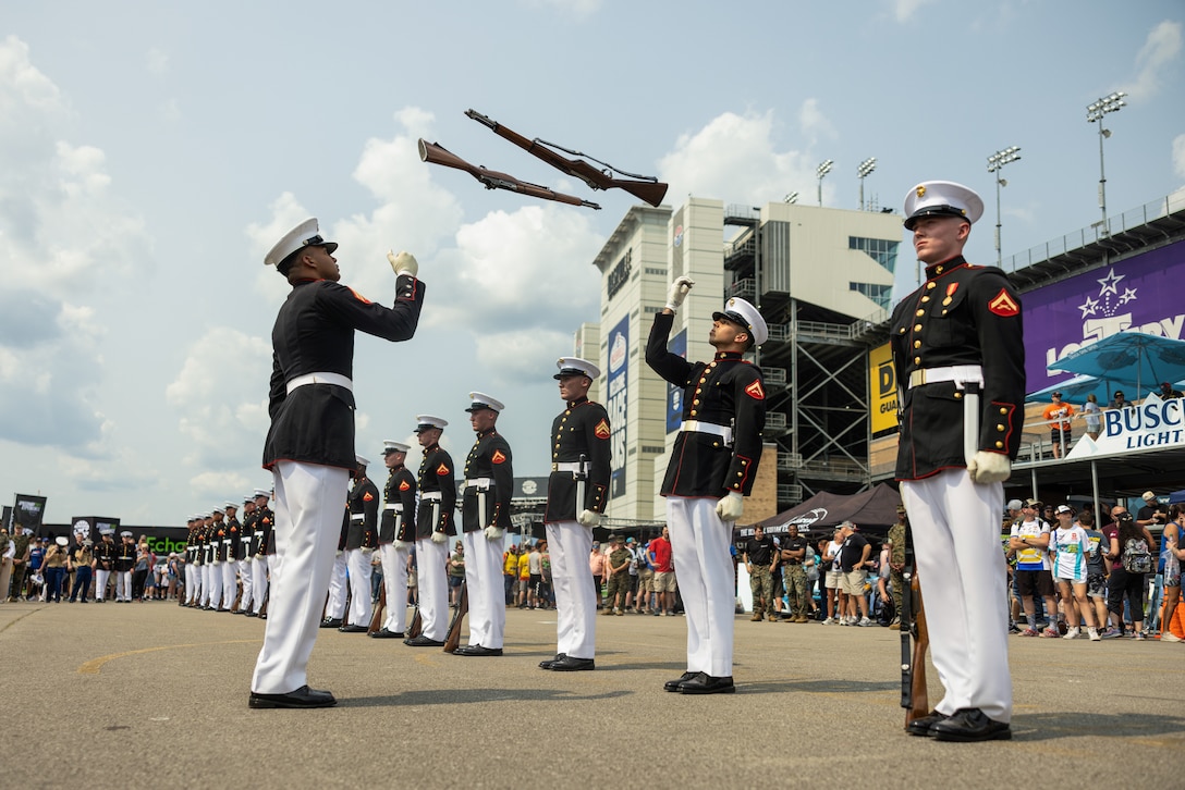 U.S. Marines with the United States Marine Corps Silent Drill Platoon execute their "double inspection" sequence during their performance at the Cracker Barrel 400 brand activation during Marine Week Nashville 2025 at the Nashville Superspeedway, Nashville, Tennessee, June 1, 2025. Founded on November 10, 1775, the United States Marine Corps has served our nation honorably in every clime and place for 250 years. Throughout 2025, Marines across the globe will celebrate the 250th birthday of the Corps, commemorating service, sacrifice, and priding themselves on living 'Semper Fidelis' or 'Always Faithful' to their nation and to each other. (U.S. Marine Corps photo by Lance Cpl. Judith Ann Lazaro)