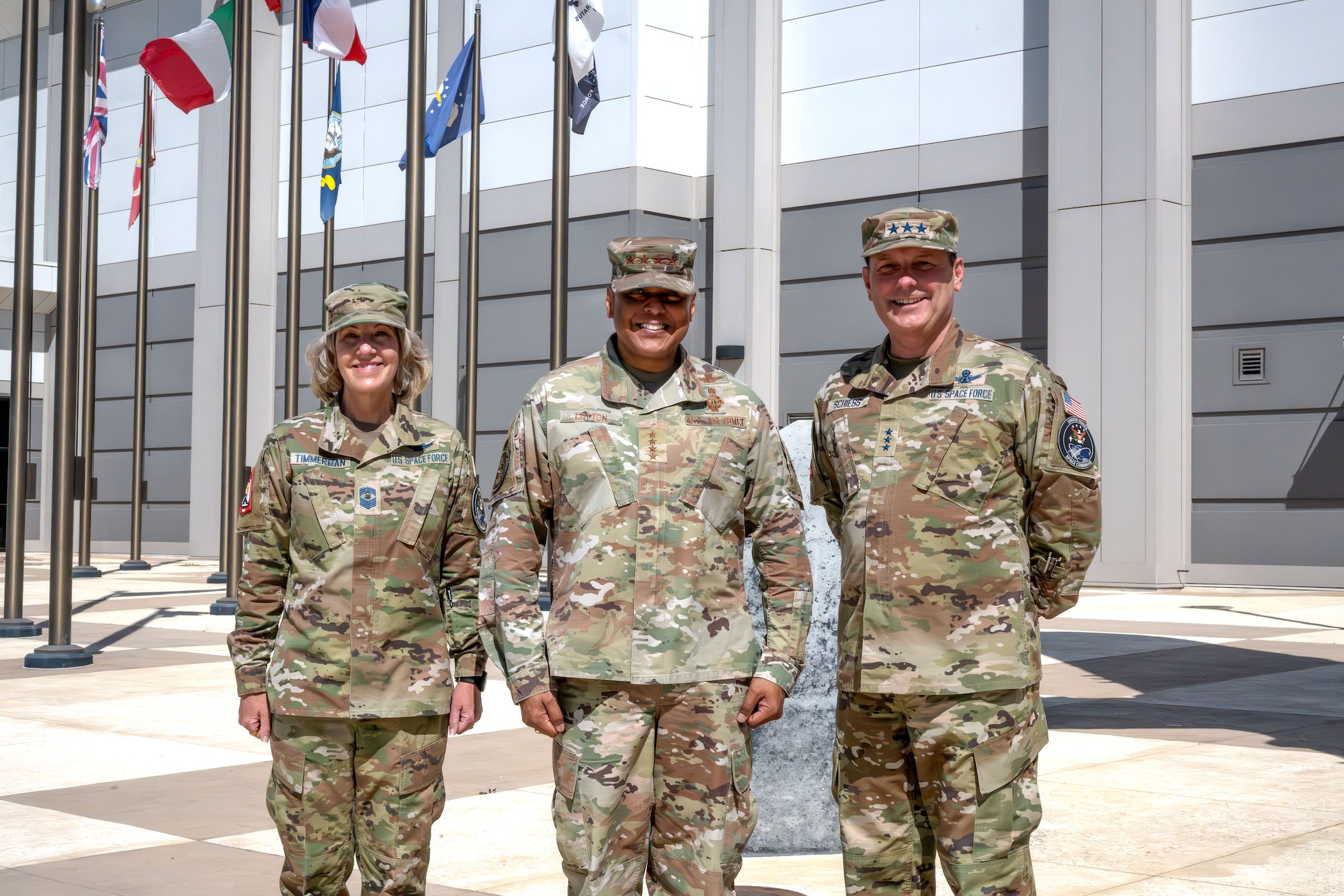 Three members of the US military pose for a photo