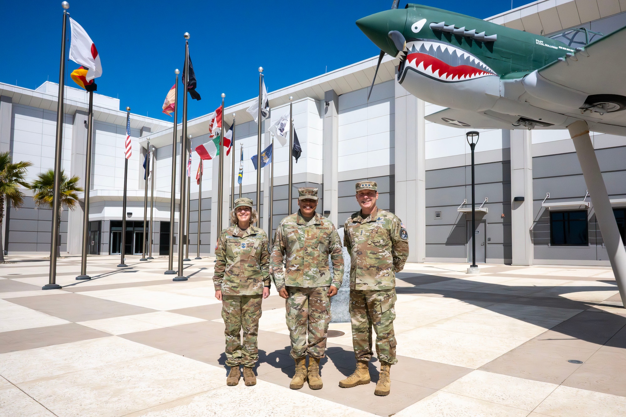 Three members of the US Military pose for a photo.
