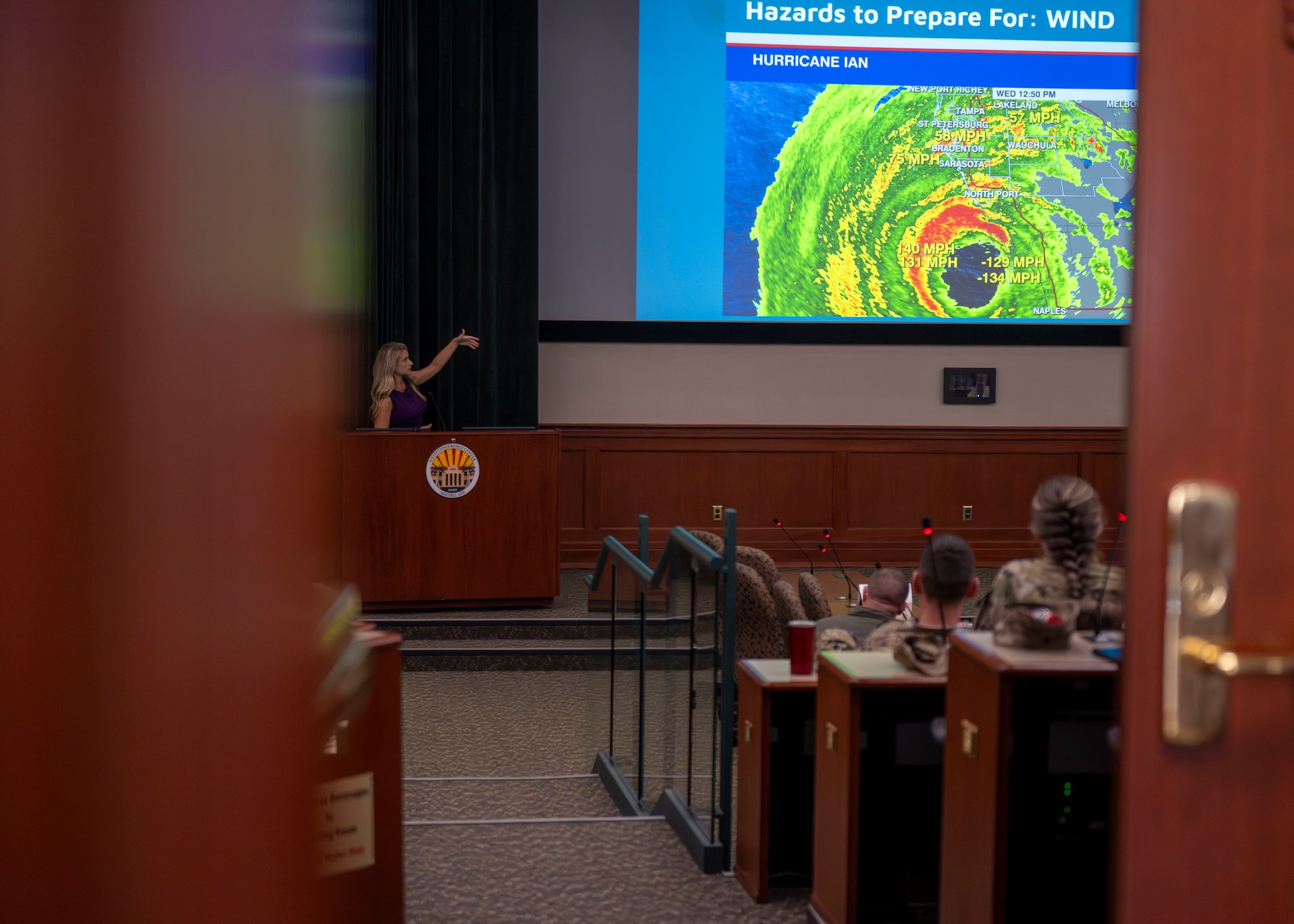 Amanda Holly, broadcast meteorologist for Channel 8 News, speaks during a hurricane operations brief at MacDill Air Force Base, Florida, April 10, 2025. The brief occurred ahead of hurricane season, where MacDill AFB and the surrounding areas are at risk of tropical storms and hurricanes. (U.S. Air Force photo by Airman 1st Class Monique Stober)