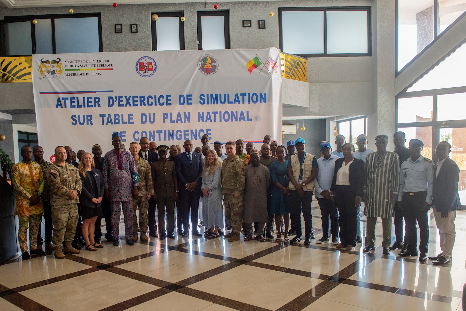 Members of the Lignite Coast Tabletop Exercise poise for a group photo with Abasse Olossoumare, chief director, Benin Ministry of Interior and Public Security; Abdel Aziz Bio Djibril, director general, Benin Agency for Civil Protection; Bienvenue Dedegnon Milohin, Mono prefet; and Jocelyn Ayicoue Ahyi, Grand Popo mayor, Grand Popo, Benin, May 12, 2025.