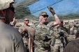 U.S. Army Reserve Lt. Col. Robert Fincher, commander of 934th Forward Resuscitative Surgical Detachment, teaches his Soldiers the capabilities of specific camo netting that provides concealment from drones flying in the area during Exercise Global Medic, at Fort Hunter Liggett, California, on May 30, 2025. The Medical Readiness Training Command executes Exercise Global Medic as part of Operation Mojave Falcon focused on the 807th Theater Medical Command and Army Reserve Medical Command's larger mission to deliver relevant and realistic collective training to medical units and Soldiers preparing for large-scale combat operations. (U.S. Army photo by Staff Sgt. Mikayla Fritz)