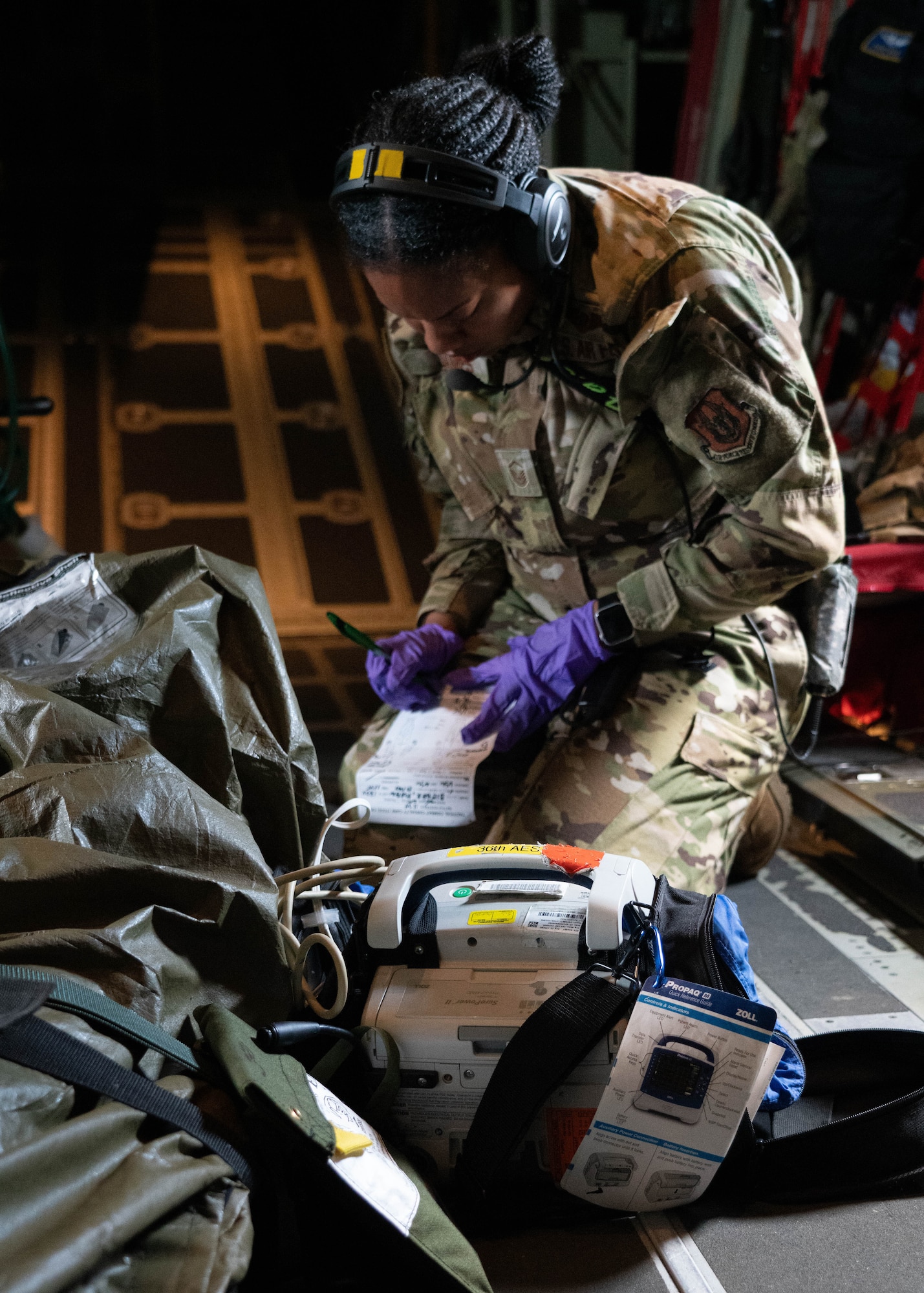 Airman working on simulated patient.