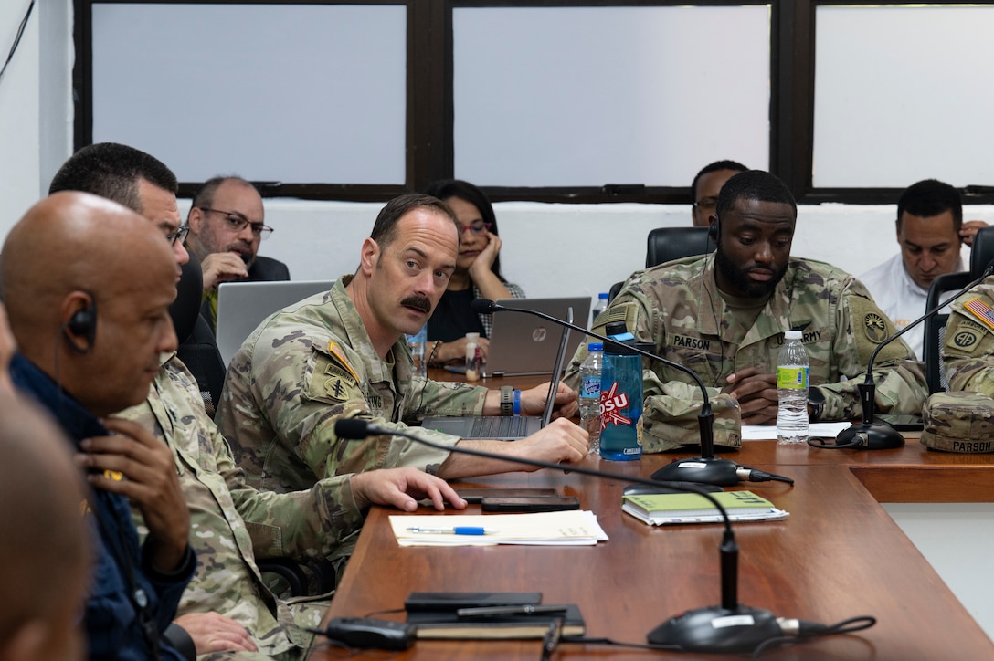 U.S. Army Maj. Frank Glutting, Joint Task Force-Bravo civil military operations deputy director, gives opening remarks during Jaguar Sentinel knowledge exchange in Santo Domingo, Dominican Republic, May 7, 2025. Each member presented their capabilities for the simulated disaster to help further synchronize their response for future operations. (U.S. Air Force photo by Staff Sgt. Sadie Colbert)