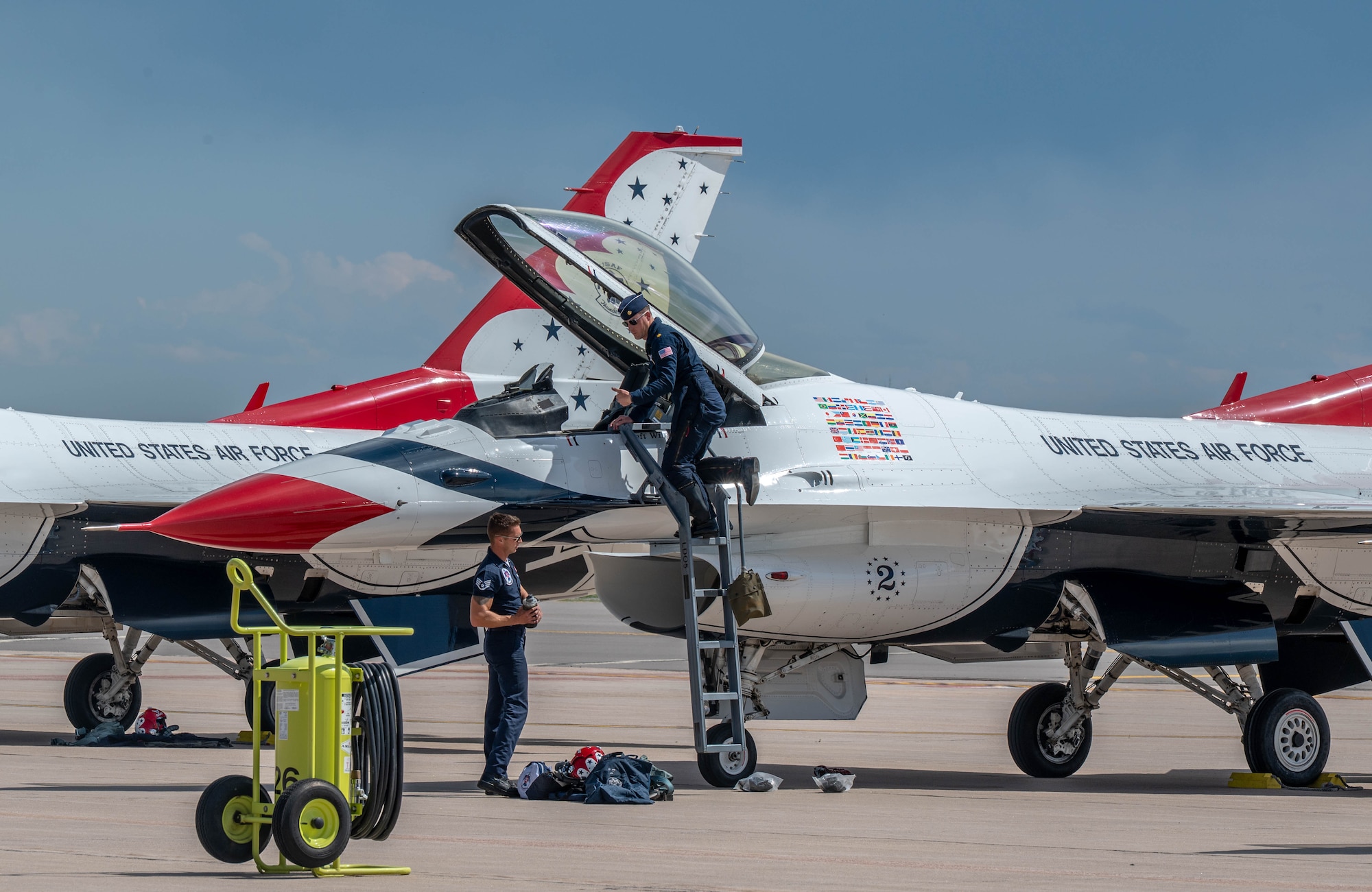 Thunderbird pilot gives a thumbs up to a maintainer as he exits an F16