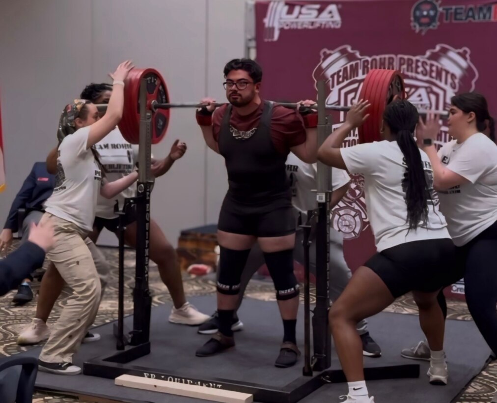 Staff Sgt. Mario Silveria completes a squat at the USA Powerlifting Military, Police, & Firefighter's Nationals