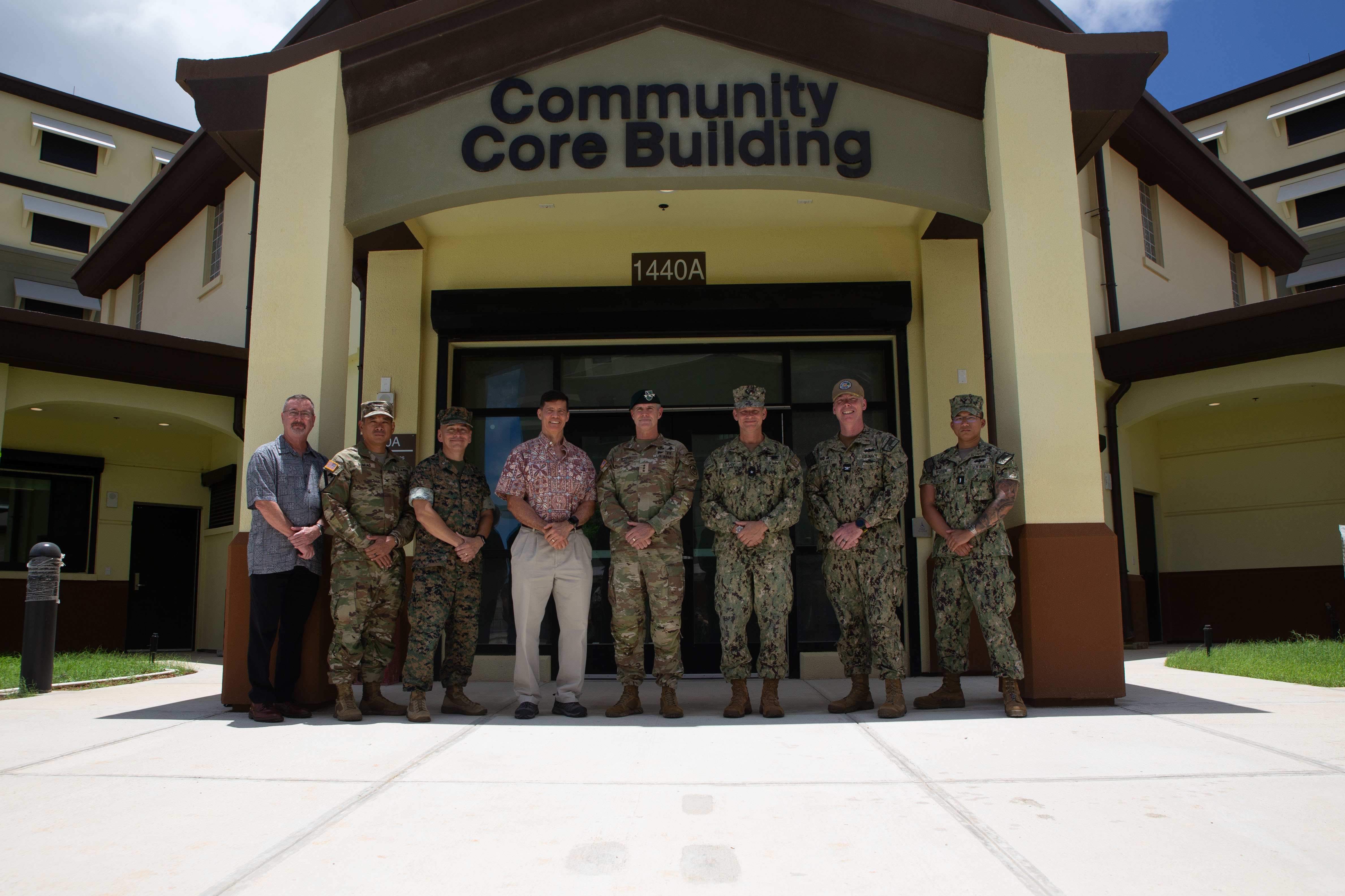 U.S. senior service members and civilians with Marine Corps Base Camp Blaz, Joint Task Force Micronesia and U.S. Indo-Pacific Command pose for a photo outside the Community Core Building of the barracks on Marine Corps Base Camp Blaz, Guam, May 15, 2025. Senior leaders visited MCB Camp Blaz to see the overall progress of construction of the main cantonment and the facilities. (U.S. Marine Corps photo by Lance Cpl. Afton Smiley)