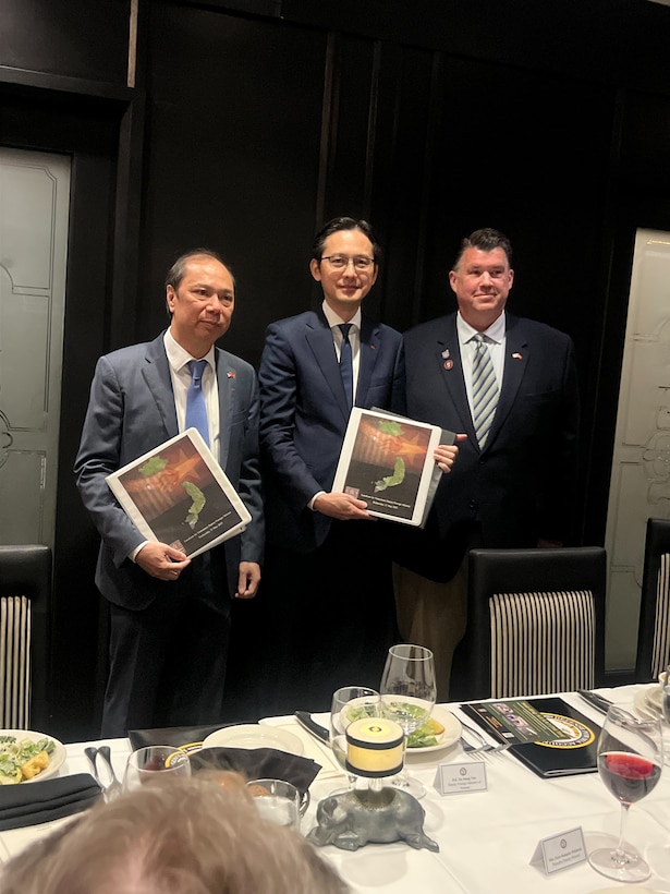 Dave Huffman,  Executive Director of Mission: POW/MIA, presents Deputy Foreign Minister of Vietnam, H.E. Do Hung Viet, and H.E. Nguyen Quoc Dzung, Ambassador Extraordinary and Plenipotentiary of Vietnam to the United States, with documentation and the location of a potential mass grave, reportedly containing the remains of 22 Viet Cong and North Vietnamese Army troops during a luncheon with the Vietnamese Delegation, Washington D.C., May 21, 2025.
