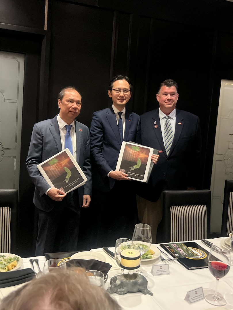 Dave Huffman,  Executive Director of Mission: POW/MIA, presents Deputy Foreign Minister of Vietnam, H.E. Do Hung Viet, and H.E. Nguyen Quoc Dzung, Ambassador Extraordinary and Plenipotentiary of Vietnam to the United States, with documentation and the location of a potential mass grave, reportedly containing the remains of 22 Viet Cong and North Vietnamese Army troops during a luncheon with the Vietnamese Delegation, Washington D.C., May 21, 2025.