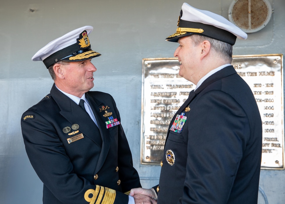 Royal Australian Chief of Navy Vice Adm. Mark Hammond, AO, of the Royal Australia Navy is greeted by U.S. 7th Fleet Commander Vice Adm. Fred Kacher on the quarterdeck of the 7th Fleet flagship USS Blue Ridge (LCC 19) while the ship is conducting a scheduled port call in Sydney, May 28, 2025.