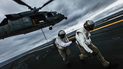 PHILIPPINE SEA (May 28, 2025) — Chief Logistics Specialist Jonathan Cruz, right, from Olongapo, Philippines, and Chief Logistics Specialist Antonio Evans, from Los Angeles, both assigned to supply department’s aviation supply division, participate...