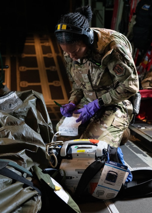 Airman working on simulated patient.