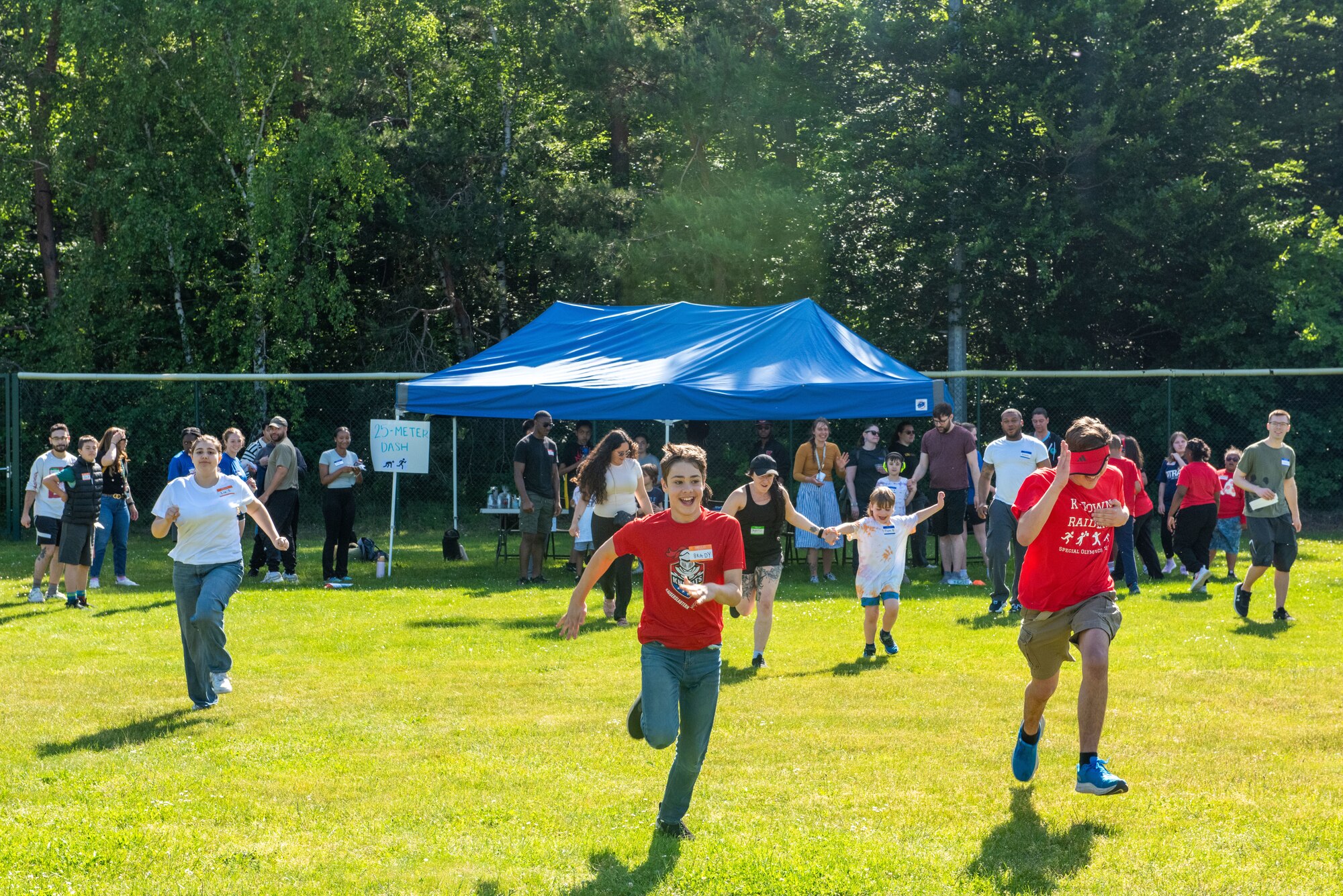 Students run a 25-meter dash.