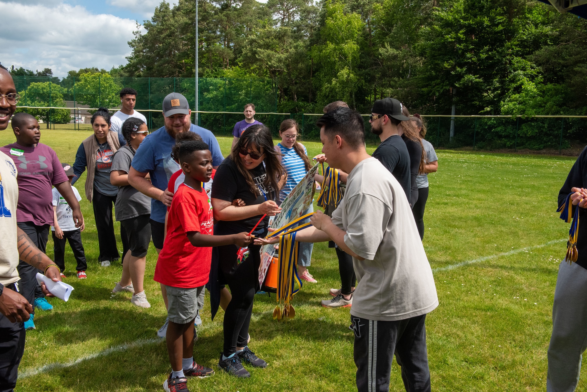 Students receive medals during a parade.