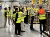 The 405th Army Field Support Brigade headquarters conducted a professional development staff visit to the Amazon Fulfillment Center in West Kaiserslautern May 30. There, they were greeted by Frederic Le Pon, the operations manager for outbound shipping, who provided a briefing and tour of the center.
