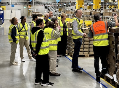 The 405th Army Field Support Brigade headquarters conducted a professional development staff visit to the Amazon Fulfillment Center in West Kaiserslautern May 30. There, they were greeted by Frederic Le Pon, the operations manager for outbound shipping, who provided a briefing and tour of the center.