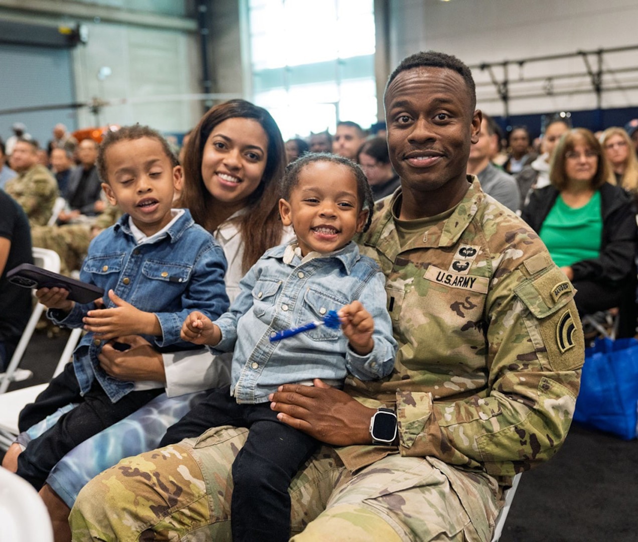 A New York Army National Guard Soldier assigned to the 42nd Infantry Division and his family attend the farewell ceremony held at the Nassau County Police Academy in Barden City on June 1, 2025.